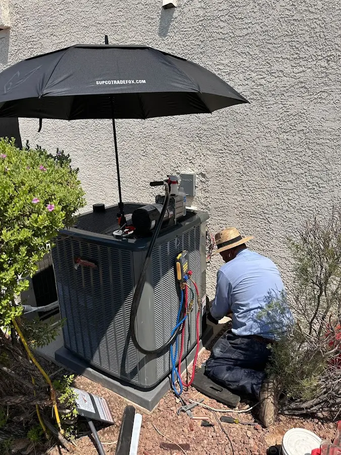HVAC technician performing outdoor AC maintenance in Duryea